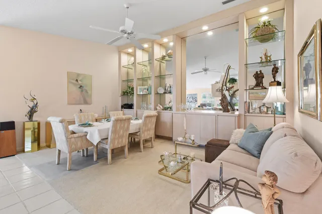 a dining room with furniture and a chandelier