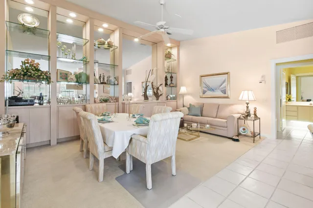 a kitchen with kitchen island a stove a table and chairs
