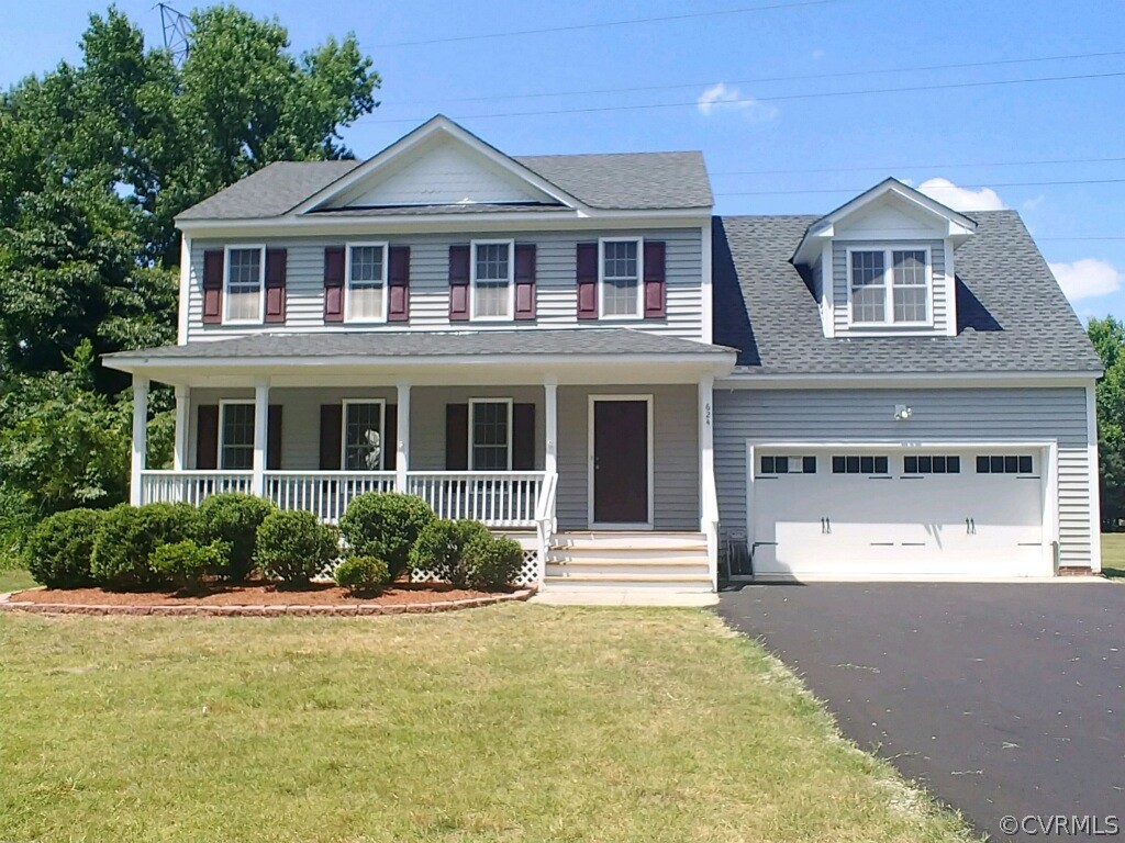 624 Enon Church Road Chester, VA 23836 - Photo 1 of 9 a front view of a house with a yard and garage