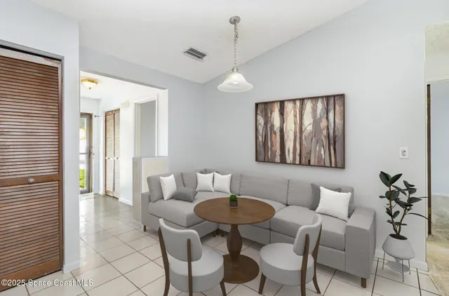 a view of a livingroom with furniture and a window
