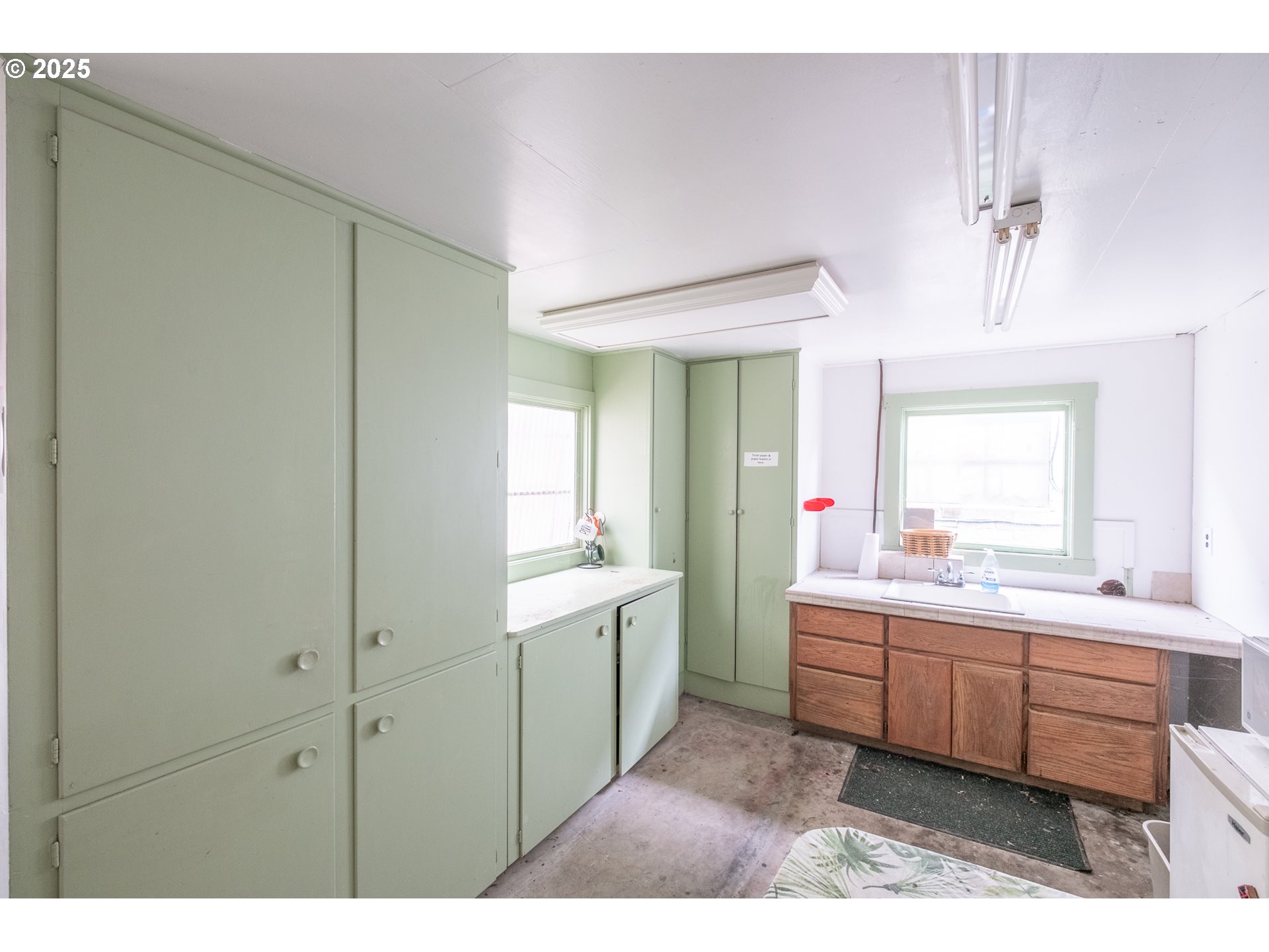 55 Q Street Cottage Grove, OR 97424 - Photo 13 of 36 a kitchen with a sink and cabinets