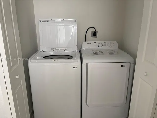 a utility room with dryer and washer
