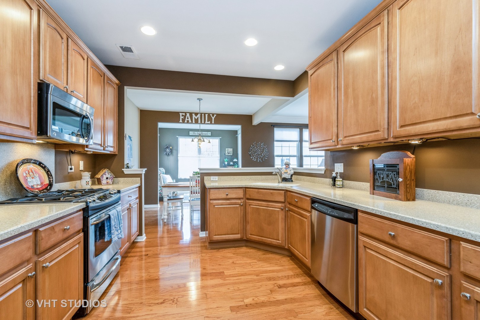 2832 Cascade Falls Circle Elgin, IL 60124 - Photo 9 of 37 a kitchen with stainless steel appliances granite countertop wooden cabinets a sink dishwasher a stove and a refrigerator