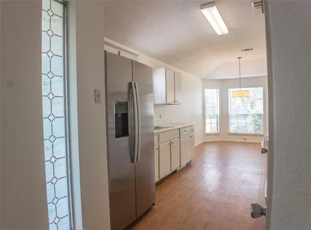 a view of a dining room with furniture and window