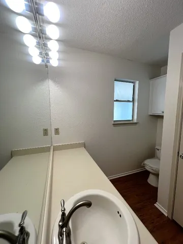 a view of a room with wooden floor