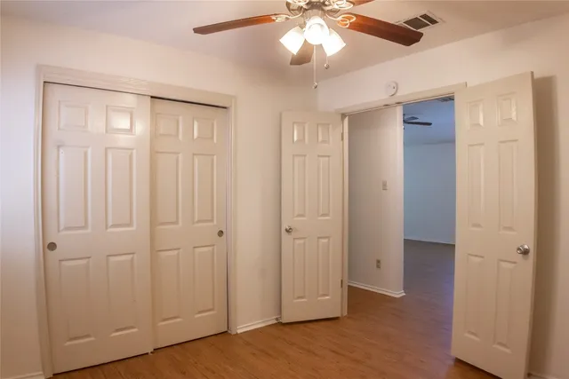 a bathroom with a toilet and a bath tub