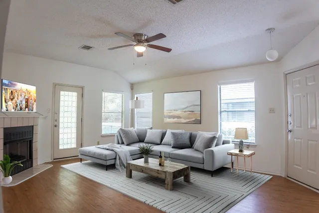 an empty room with wooden floor and mirror