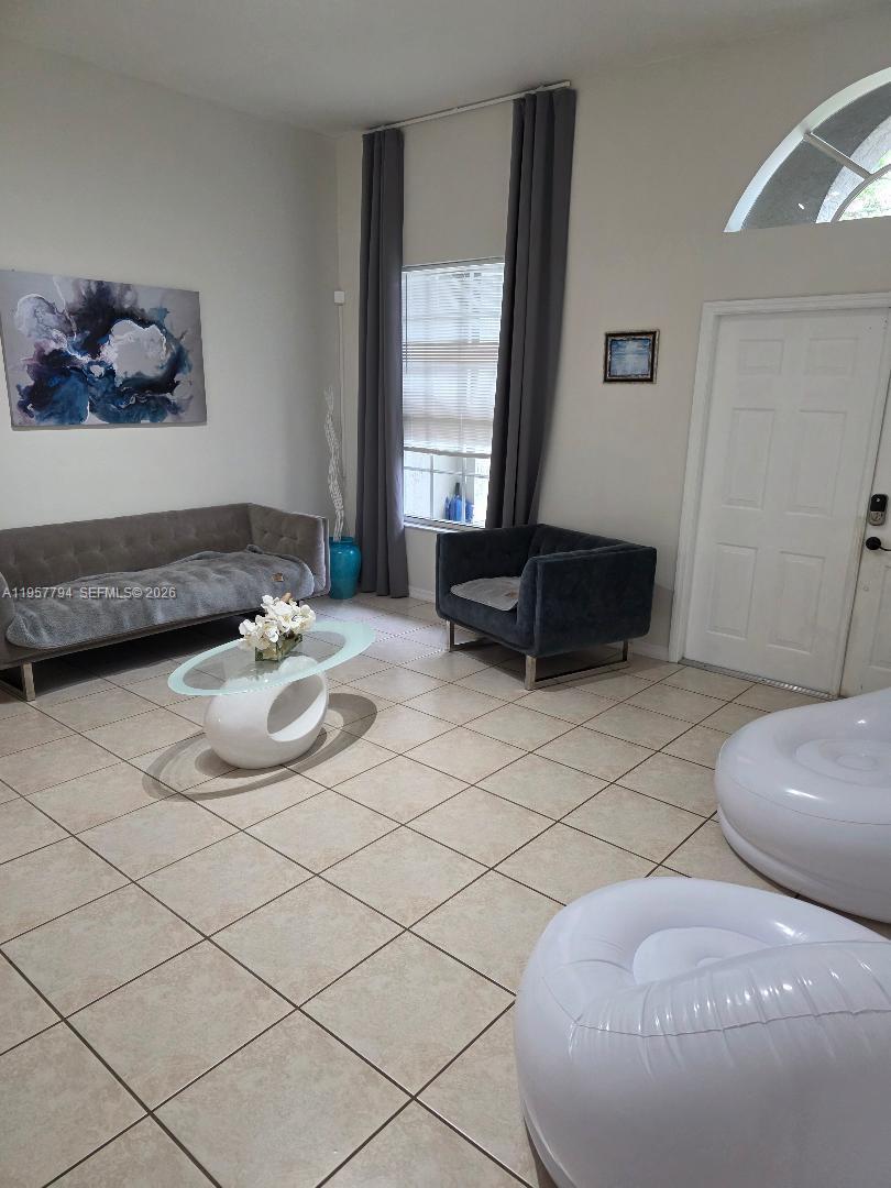 15764 Southwest 101st Street Miami, FL 33196 - Photo 7 of 27 a living room with furniture