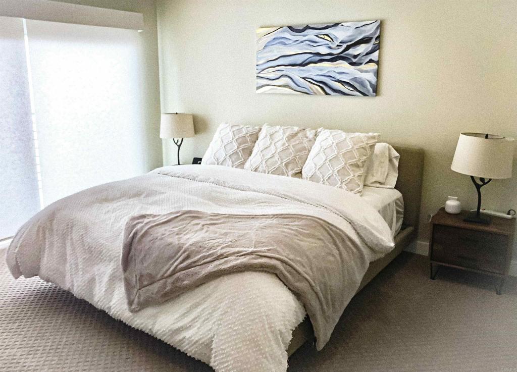 1903 South Myers Street, Unit 3 Oceanside, CA 92054 - Photo 11 of 30 a bedroom with a bed and painting on the wall