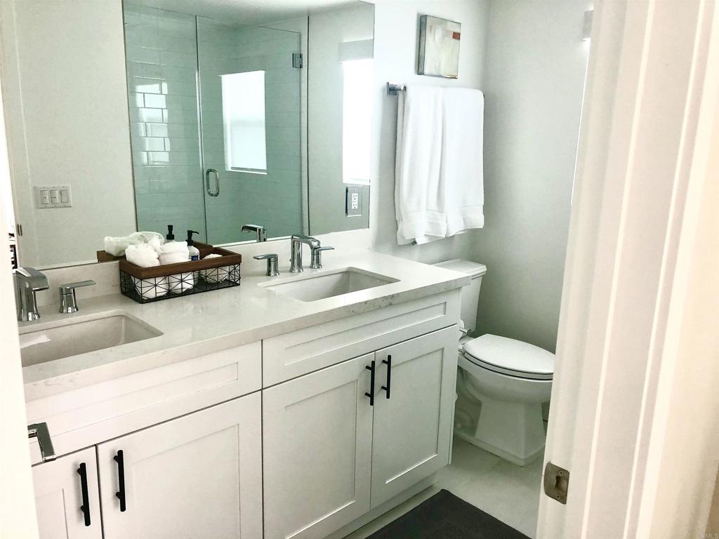 1903 South Myers Street, Unit 3 Oceanside, CA 92054 - Photo 12 of 30 a bathroom with a sink a toilet and mirror