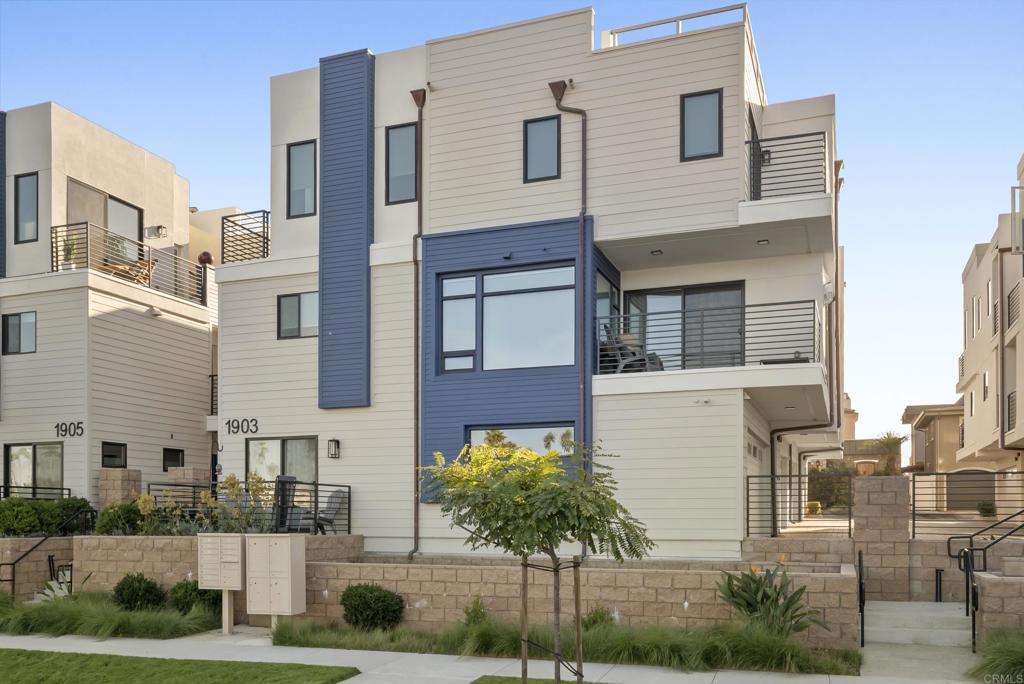 1903 South Myers Street, Unit 3 Oceanside, CA 92054 - Photo 23 of 30 a front view of a residential apartment building with a yard