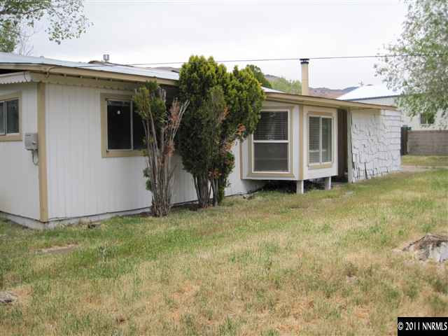 15410 Toll Road Reno, NV 89521 - Photo 8 of 13 a view of a house with a yard