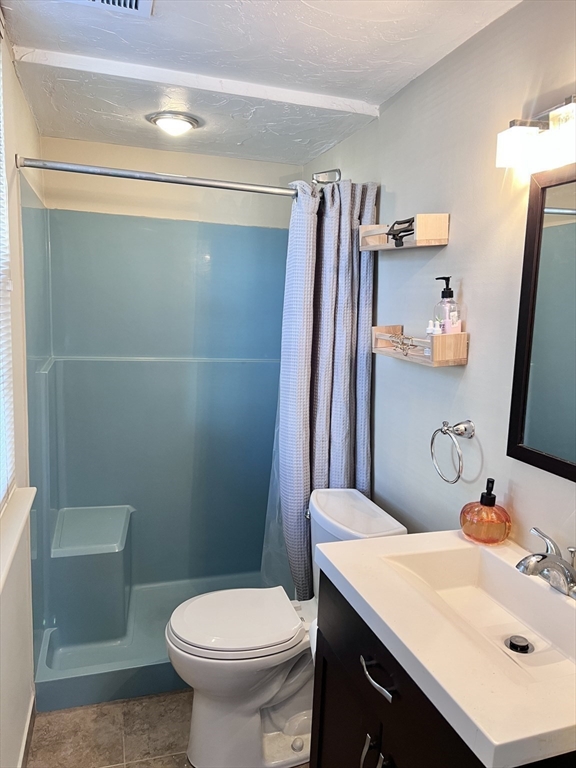 39 Christopher Drive, Unit B Stoughton, MA 02072 - Photo 17 of 38 a bathroom with a sink toilet and shower