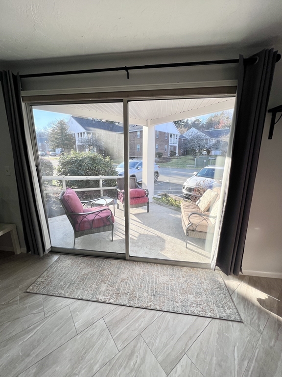 39 Christopher Drive, Unit B Stoughton, MA 02072 - Photo 23 of 38 a living room filled with furniture