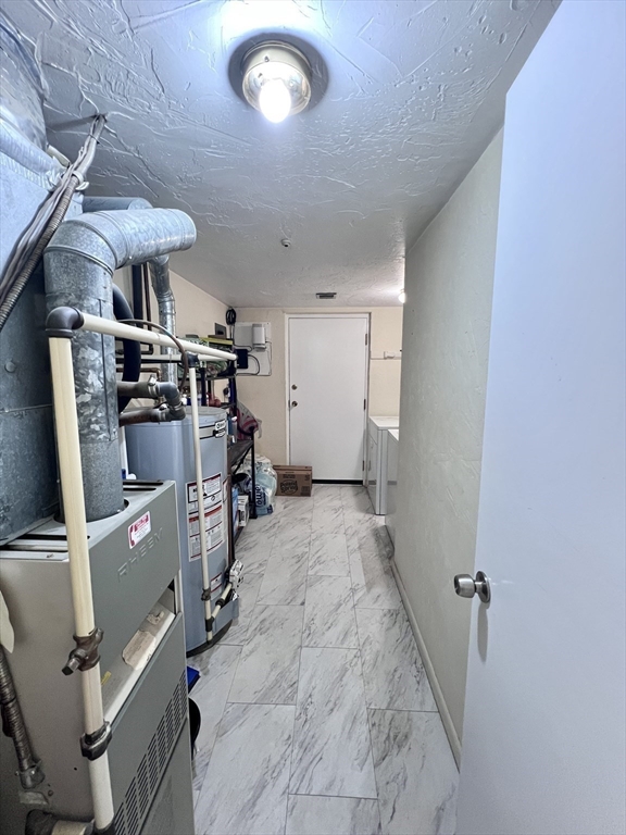 39 Christopher Drive, Unit B Stoughton, MA 02072 - Photo 25 of 38 a view of a storage & utility room