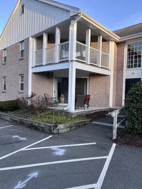 39 Christopher Drive, Unit B Stoughton, MA 02072 - Photo 30 of 38 a front view of house with yard