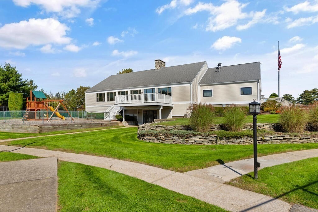 39 Christopher Drive, Unit B Stoughton, MA 02072 - Photo 33 of 38 a front view of a house with a yard