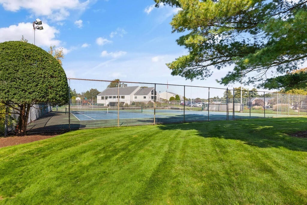 39 Christopher Drive, Unit B Stoughton, MA 02072 - Photo 35 of 38 a view of yard with swimming pool outdoor seating and green space