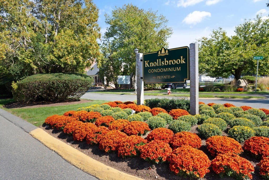 39 Christopher Drive, Unit B Stoughton, MA 02072 - Photo 36 of 38 a sign on the side of the road