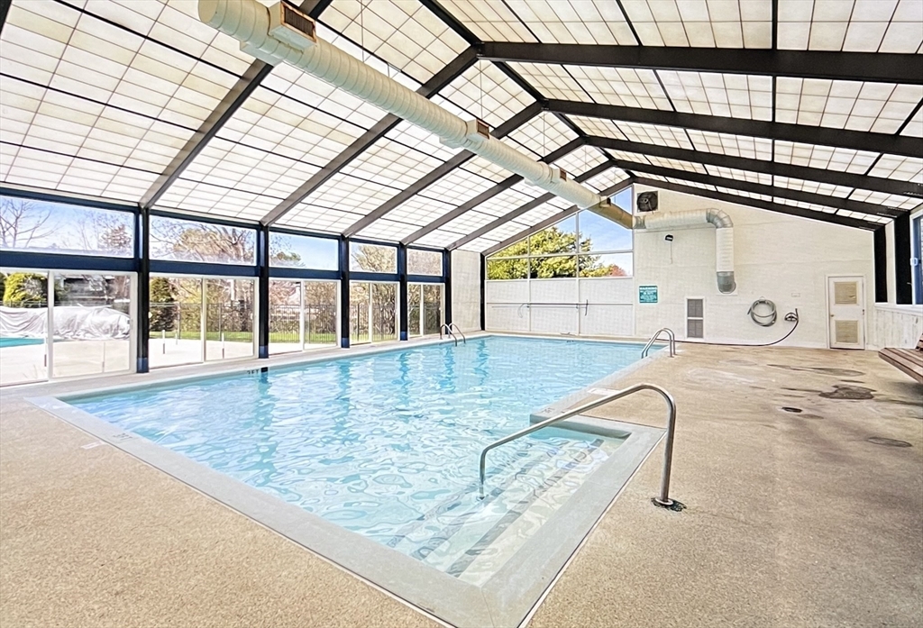 39 Christopher Drive, Unit B Stoughton, MA 02072 - Photo 37 of 38 a view of swimming pool with a sitting space