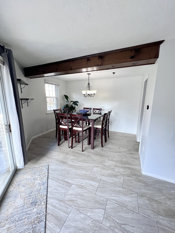 39 Christopher Drive, Unit B Stoughton, MA 02072 - Photo 7 of 38 a view of a dining room with furniture and chandelier