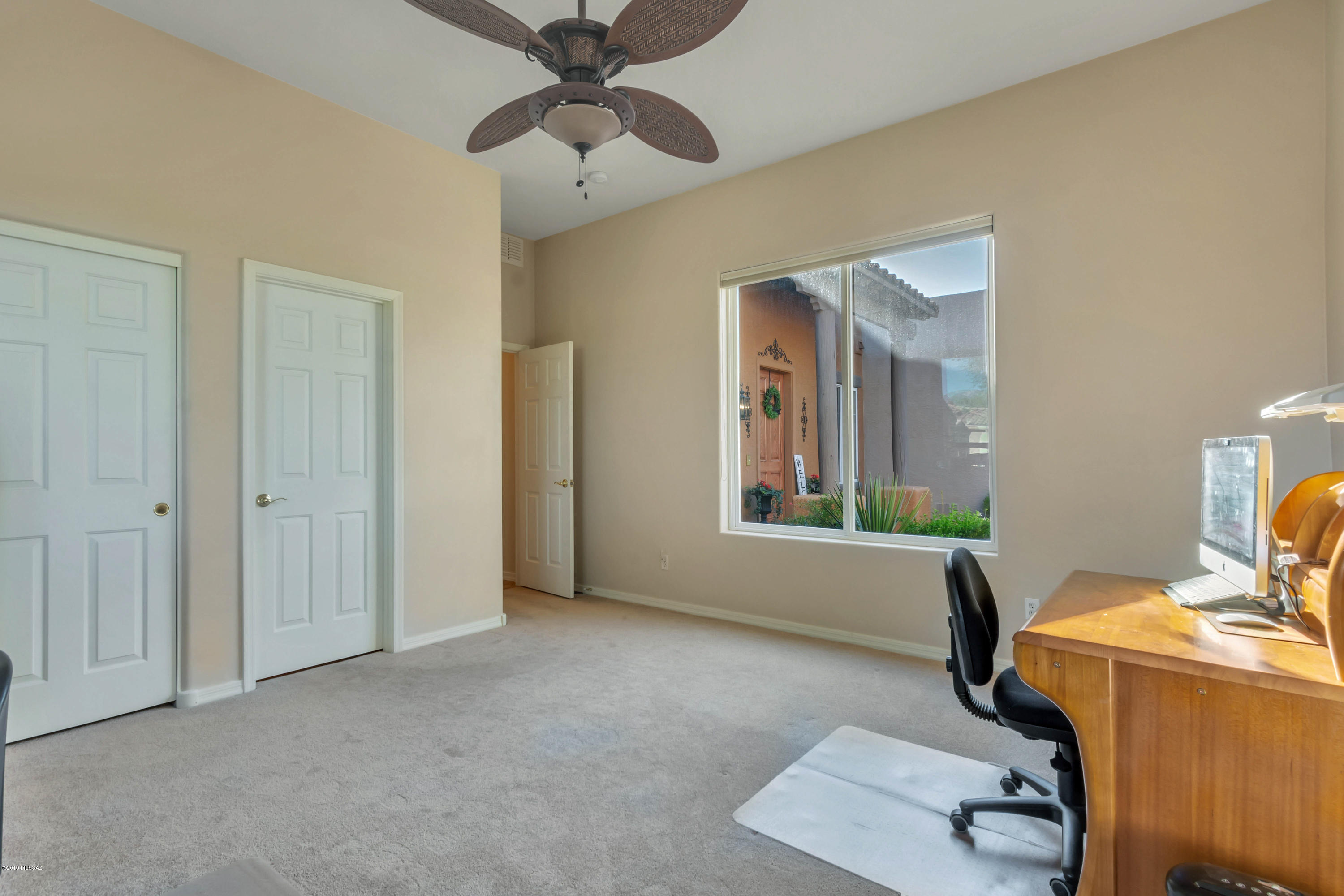 12682 North Spirit Mountain Road Oro Valley, AZ 85755 - Photo 13 of 40 a view of a workspace with furniture and a window