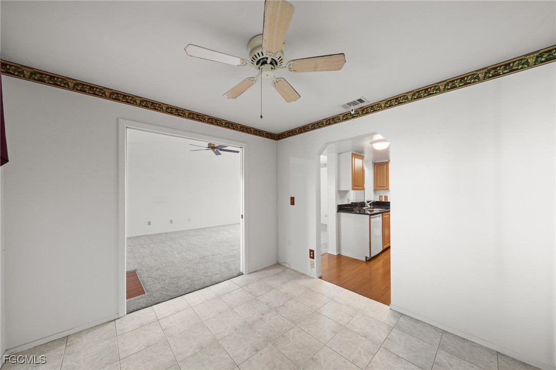 13276 White Marsh Lane, Unit 3533 Fort Myers, FL 33912 - Photo 15 of 31 a view of a hallway with a ceiling fan