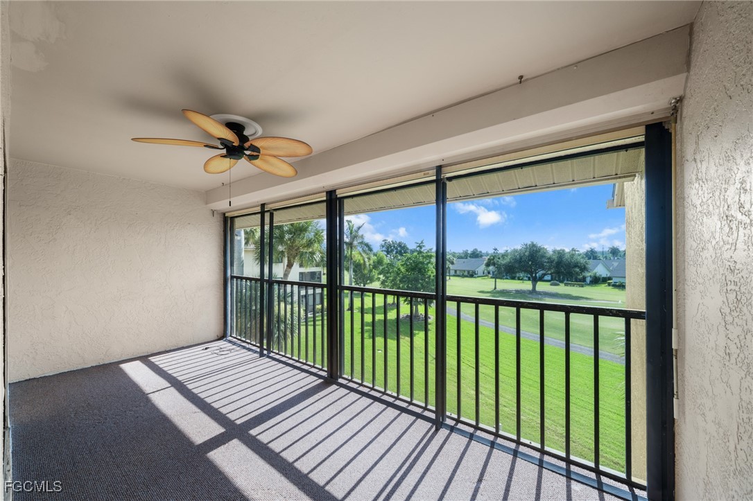 13276 White Marsh Lane, Unit 3533 Fort Myers, FL 33912 - Photo 21 of 31 a view of a balcony with wooden floor