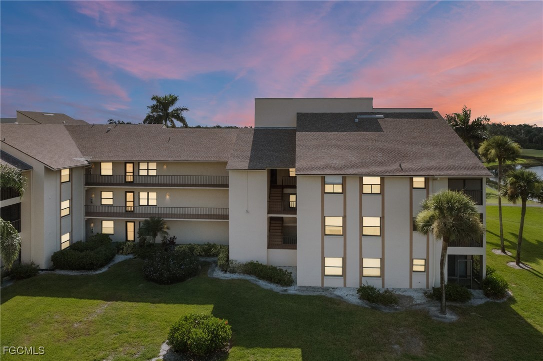13276 White Marsh Lane, Unit 3533 Fort Myers, FL 33912 - Photo 26 of 31 a front view of a house with a yard