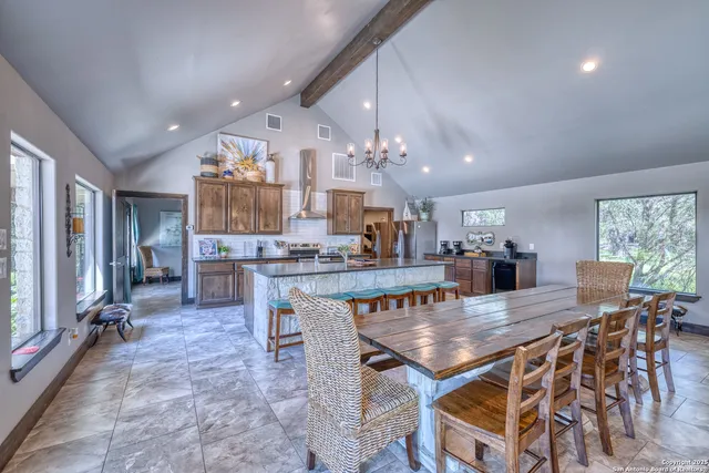 a dining room with a table and chairs in it