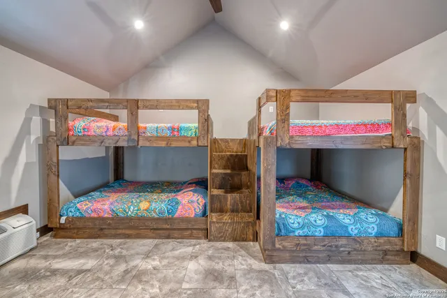 a bedroom with bed and window