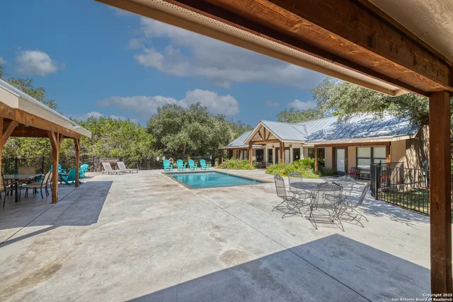 a wooden bench sitting in front of a building