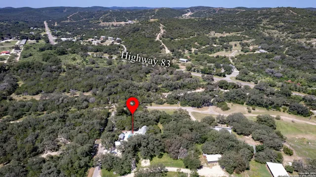 an aerial view of residential house and green space