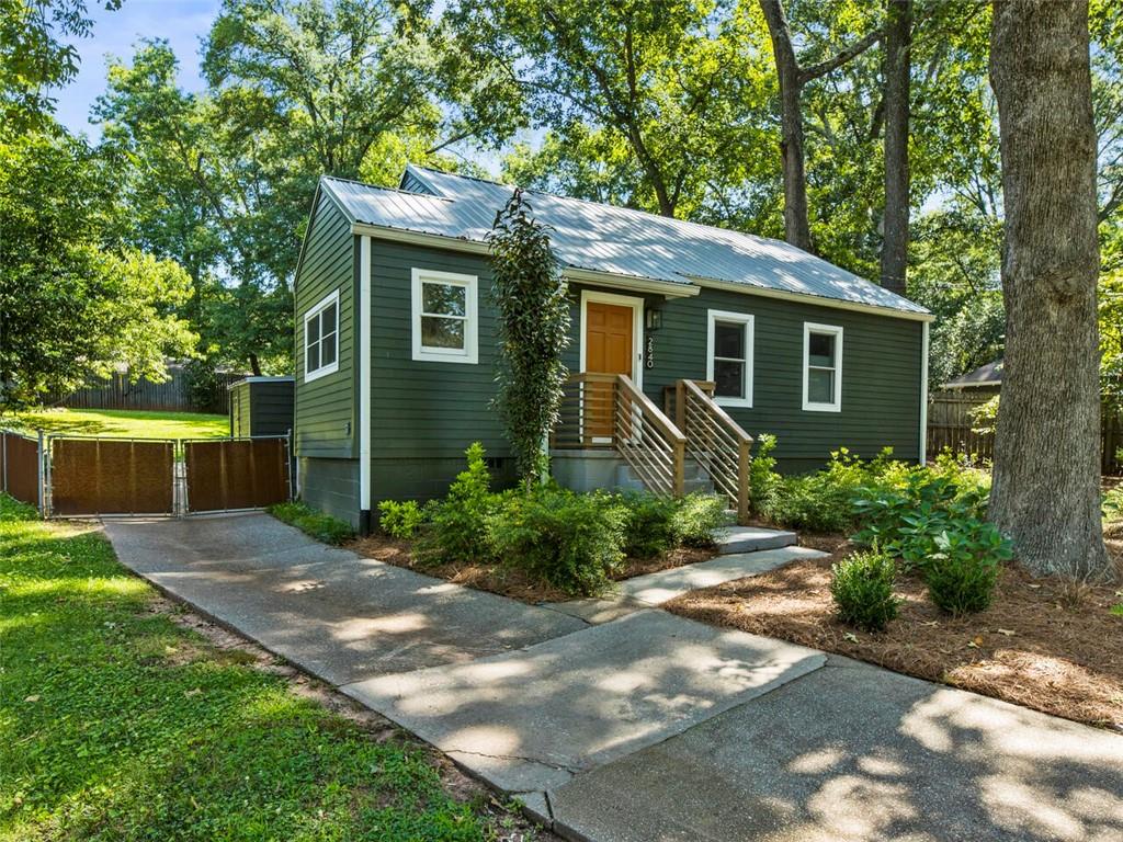 2840 Midway Road Decatur, GA 30030 - Photo 1 of 1 a front view of a house with garden
