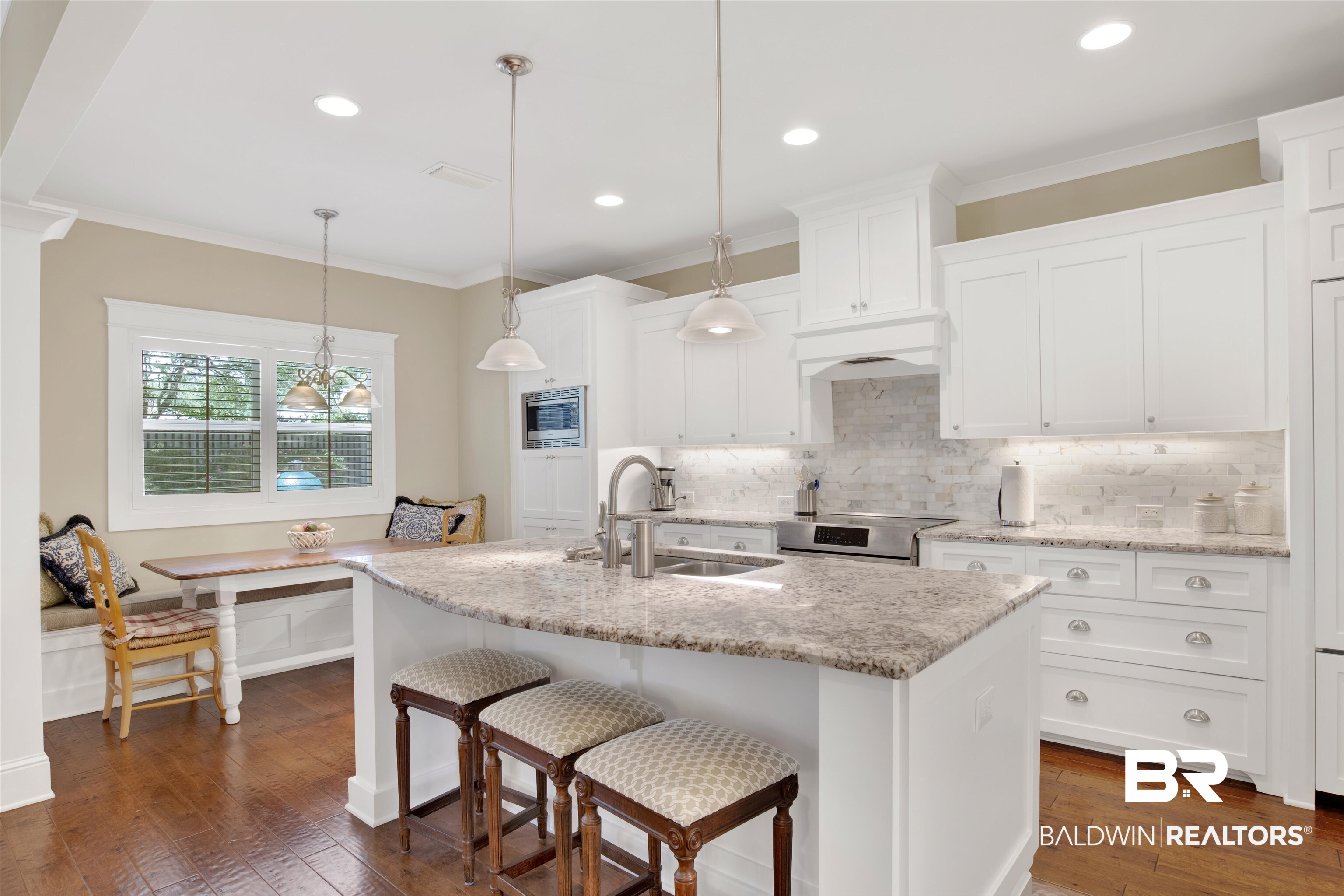 131 Sedgefield Avenue Fairhope, AL 36532 - Photo 16 of 50 Kitchen featuring dark hardwood / wood-style flooring, range, white cabinets, decorative backsplash, and sink