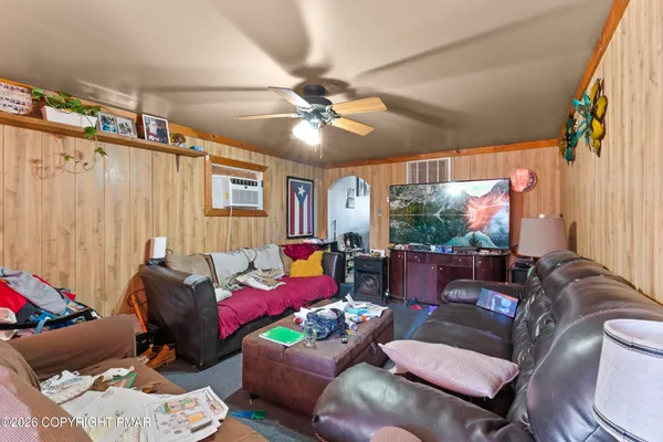 a living room with furniture and a window