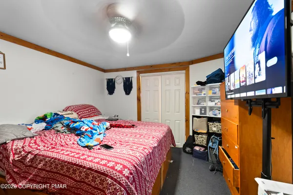 a bathroom with a toilet a sink and a shower curtain