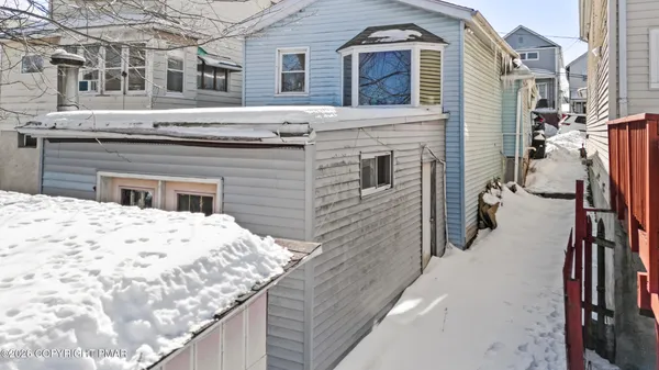 a view of a balcony with wooden walls