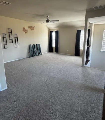 a view of a livingroom with a staircase