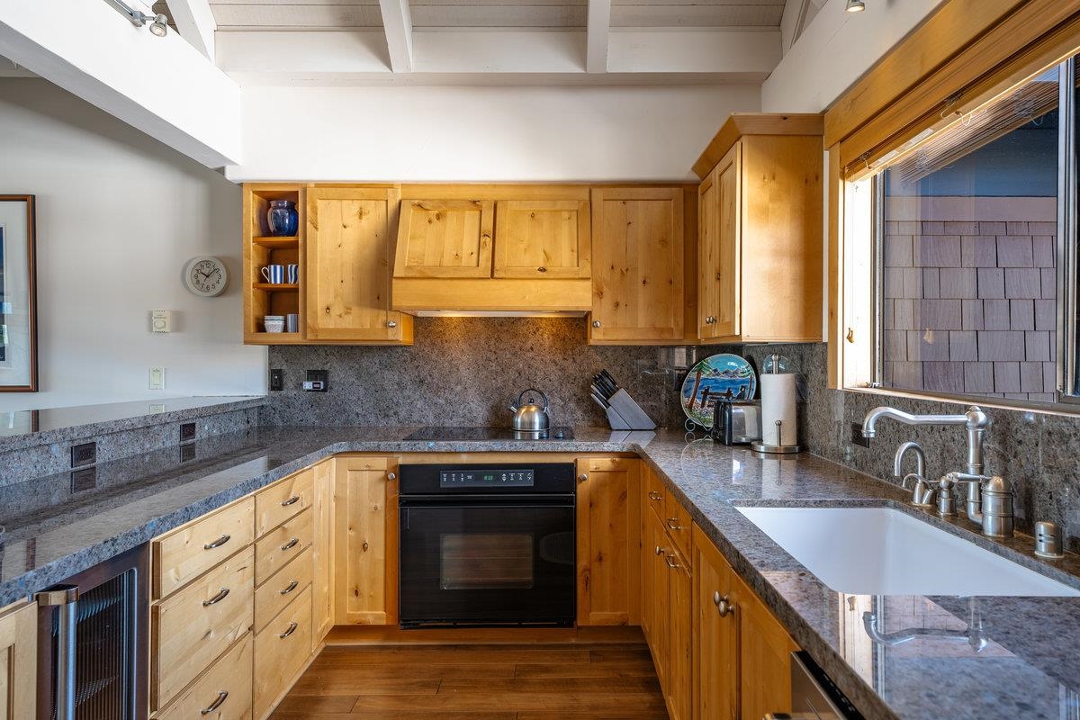 270 North North Lake Boulevard, Unit 39 Tahoe City, CA 96145 - Photo 12 of 28 a kitchen with stainless steel appliances granite countertop a sink a stove cabinets and a sink