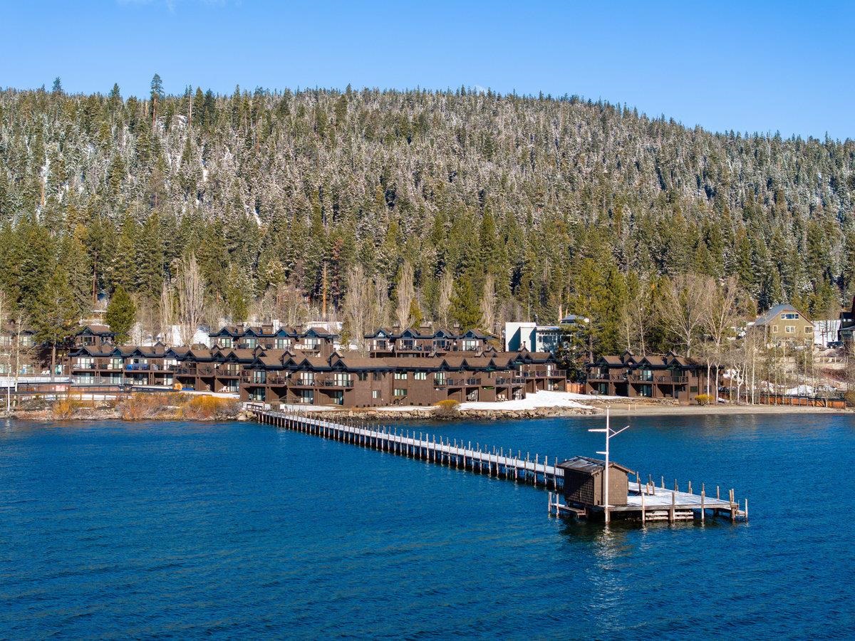 270 North North Lake Boulevard, Unit 39 Tahoe City, CA 96145 - Photo 28 of 28 a view of a lake with boats and trees in the background