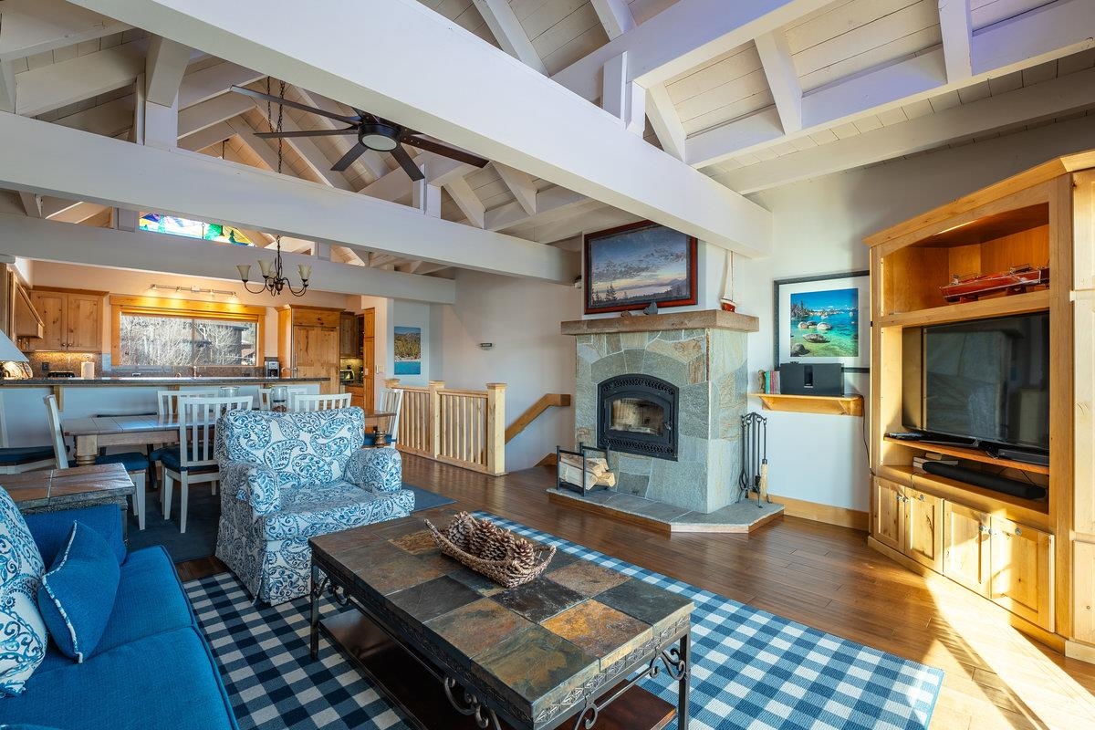 270 North North Lake Boulevard, Unit 39 Tahoe City, CA 96145 - Photo 6 of 28 a living room with furniture a flat screen tv and a fireplace