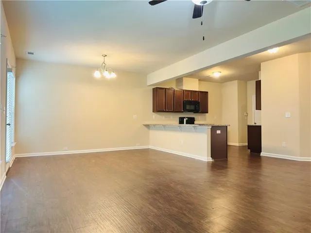 a view of a kitchen with a sink and a microwave