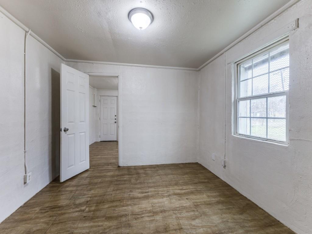 3432 Terrell Street Dallas, TX 75223 - Photo 4 of 7 an empty room with windows and closet