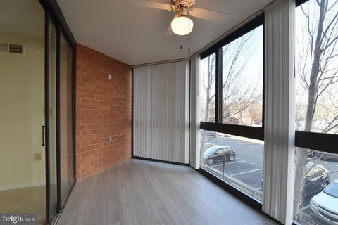 a view of an entryway with wooden floor and door