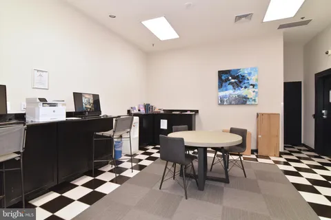 a view of a workspace with furniture