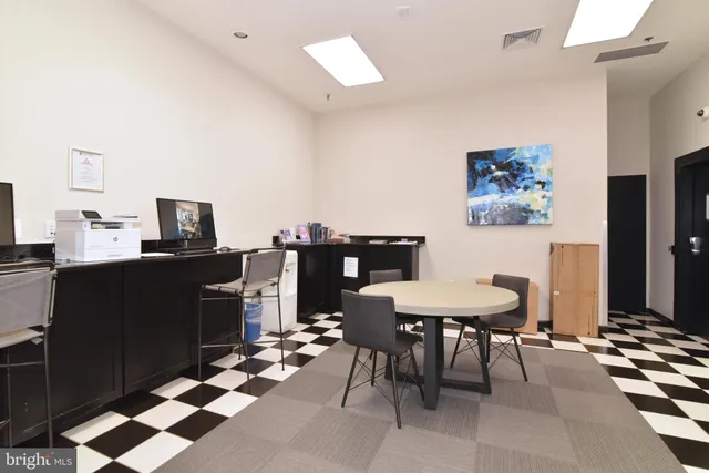 a view of a workspace with furniture