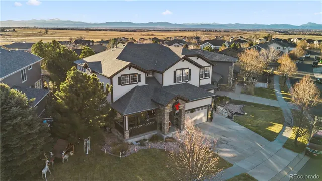 an aerial view of residential houses with outdoor space and ocean view