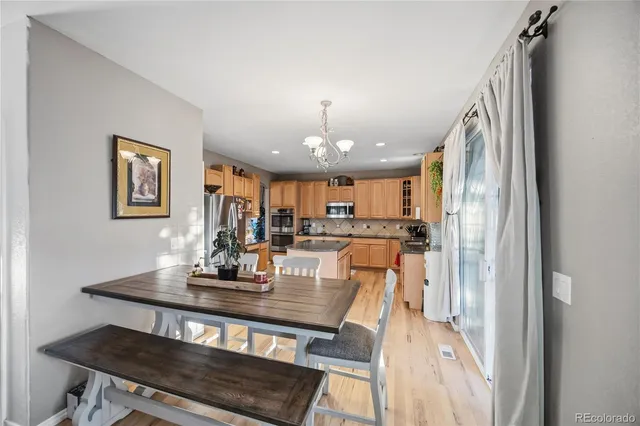 a living room with furniture flat screen tv and a fireplace