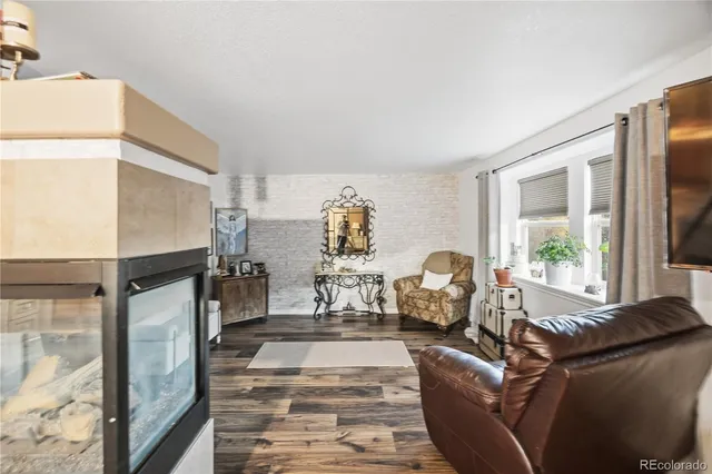a large bathroom with a granite countertop tub a sink and a window